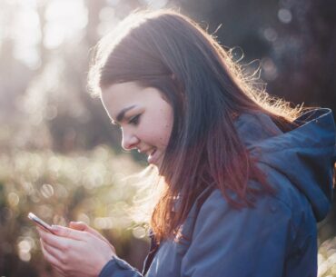 women purchasing on phone black friday ecommerce strategy